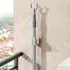 S928e393358394f919ba782fa89052263g.webp Wall-Mounted Mop and Broom Holder