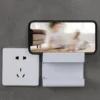 Sa75ce4caa7264cf3b195a6b367475324n.webp Wall-Mounted Remote Control and Phone Organizer