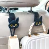 Saf2e05dd32004be58d64813ba78d87b3I.webp Cat Design Car Headrest Storage Hooks - 2 Pieces